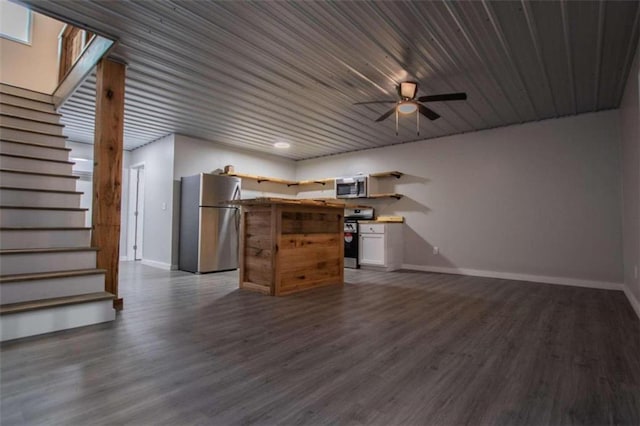 2125 Mccollum Church Rd, Lineville, AL 36266 - unfurnished living room with baseboards, stairway, dark wood-style floors, and a ceiling fan