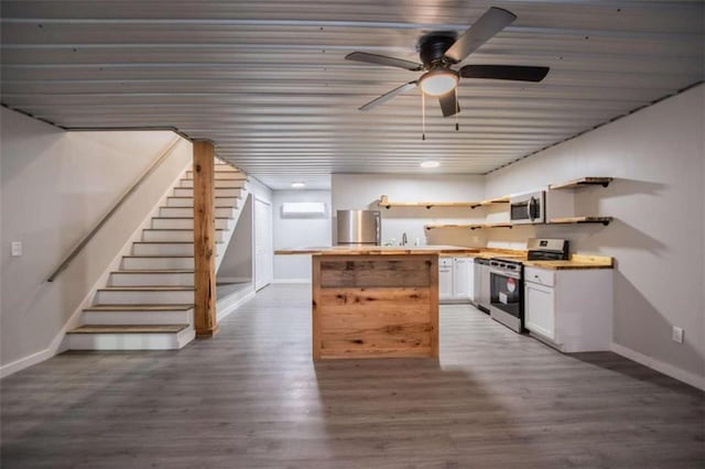 2125 Mccollum Church Rd, Lineville, AL 36266 - kitchen with stainless steel appliances, open shelves, white cabinetry, baseboards, and a ceiling fan
