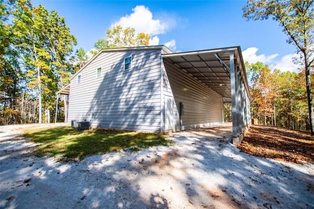 2125 Mccollum Church Rd, Lineville, AL 36266 - view of side of home featuring central air condition unit and a carport