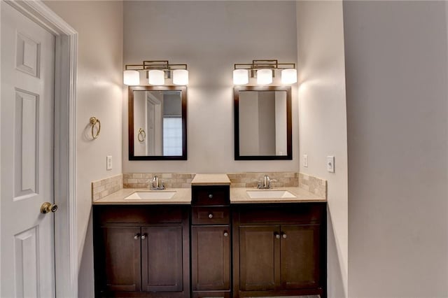 full bath featuring a sink and double vanity