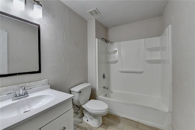 full bath with a textured wall, toilet, vanity, visible vents, and tub / shower combination