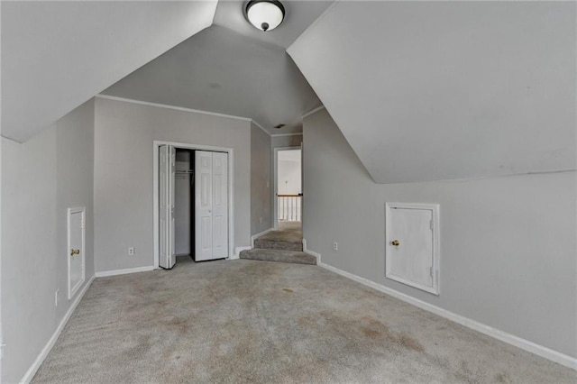 bonus room featuring carpet floors, lofted ceiling, and baseboards