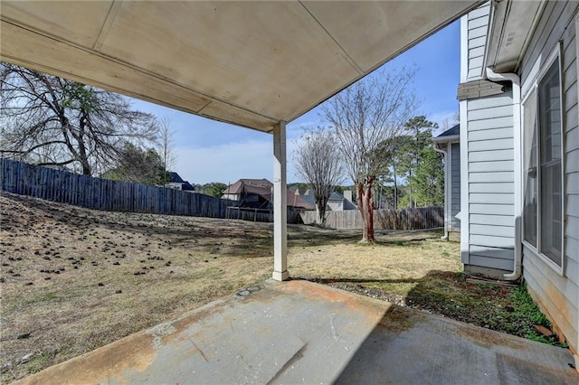 view of yard featuring a patio area and a fenced backyard