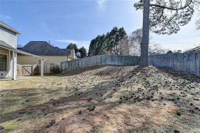 view of yard with a fenced backyard