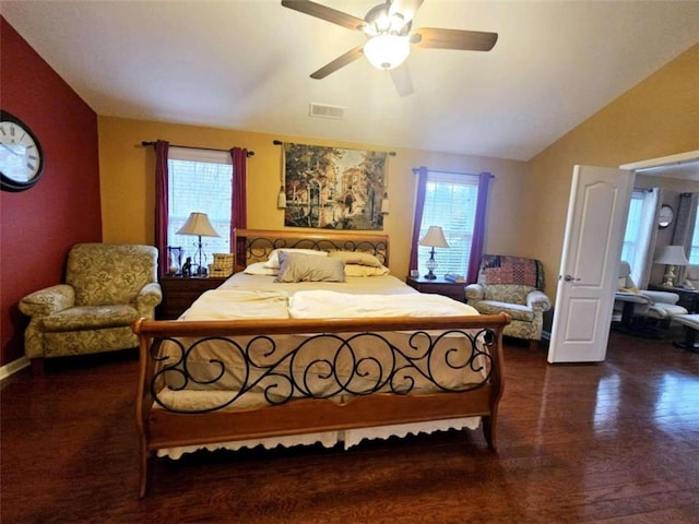 bedroom featuring dark wood-type flooring, ceiling fan, multiple windows, and vaulted ceiling