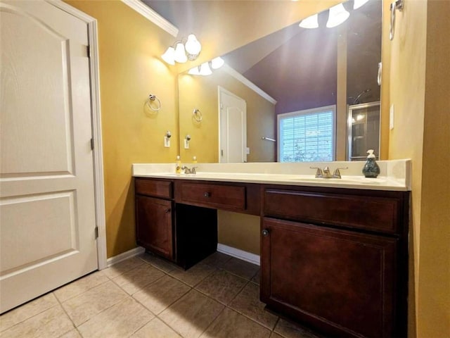 bathroom with vanity, tile patterned flooring, and ornamental molding