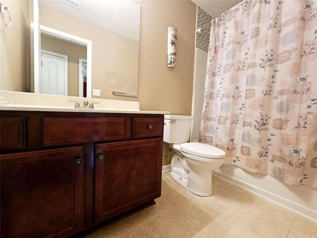 full bathroom featuring tile patterned flooring, vanity, toilet, and shower / tub combo with curtain