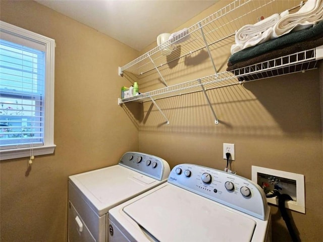 laundry room with washing machine and clothes dryer