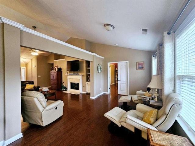 living room featuring dark wood-type flooring, lofted ceiling, and ceiling fan