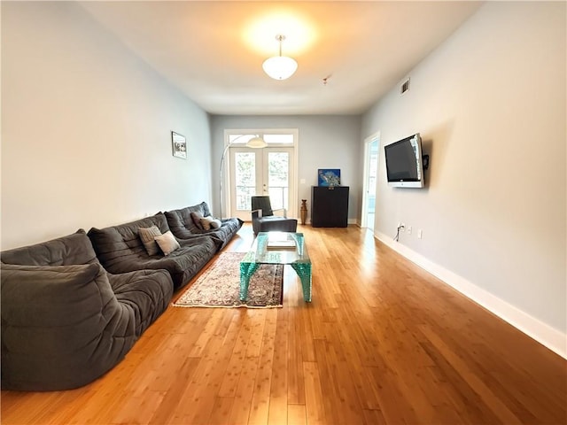3655 Peachtree Rd NE Unit 304, Atlanta, GA 30319 - living area with light wood-style flooring, french doors, and baseboards
