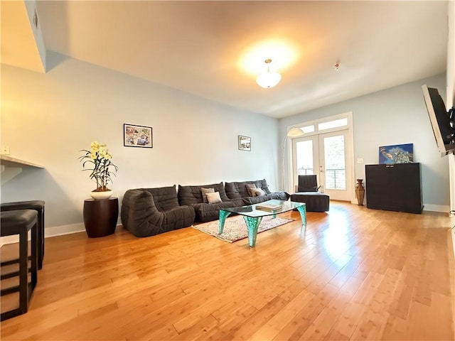 3655 Peachtree Rd NE Unit 304, Atlanta, GA 30319 - living room with light wood-style flooring, french doors, and baseboards