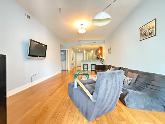 3655 Peachtree Rd NE Unit 304, Atlanta, GA 30319 - living room featuring light wood-style floors and baseboards