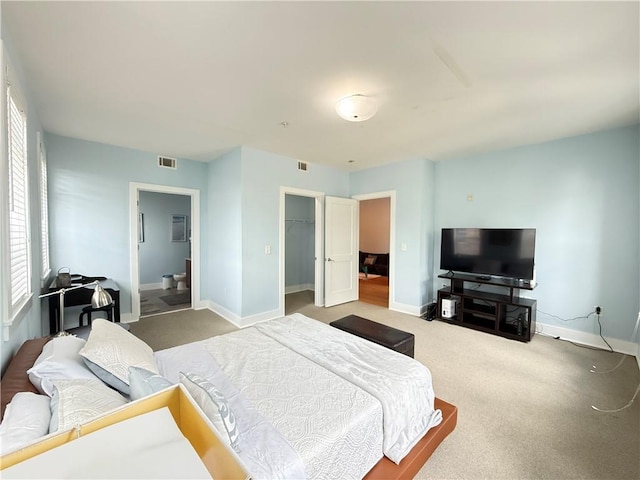 3655 Peachtree Rd NE Unit 304, Atlanta, GA 30319 - bedroom featuring carpet floors, baseboards, a spacious closet, ensuite bathroom, and a closet