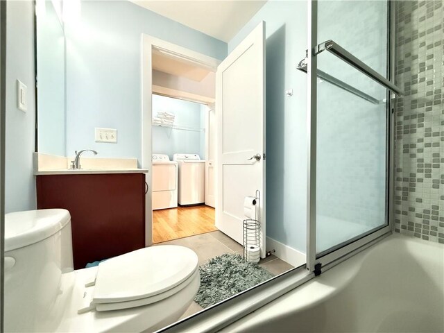 3655 Peachtree Rd NE Unit 304, Atlanta, GA 30319 - full bathroom with washing machine and clothes dryer, toilet, and vanity