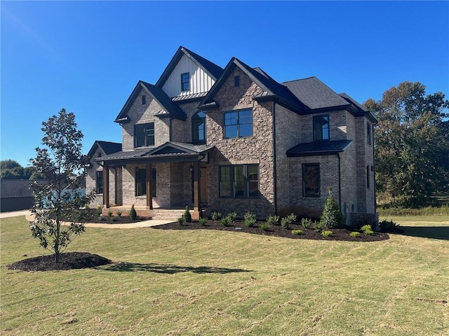 view of front of house with a porch, a standing seam roof, a front yard, and board and batten siding