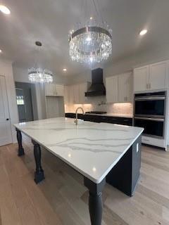 playroom with recessed lighting and light wood-style floors