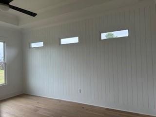 unfurnished room with wood finished floors