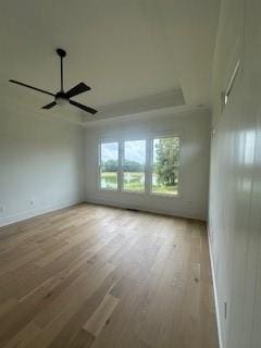 unfurnished room featuring a ceiling fan and wood finished floors