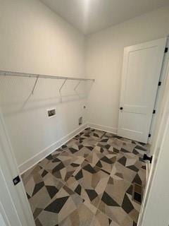 laundry room with laundry area, hookup for an electric dryer, and baseboards