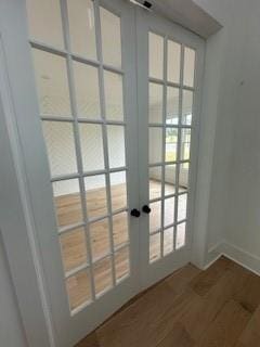 entryway with french doors and wood finished floors