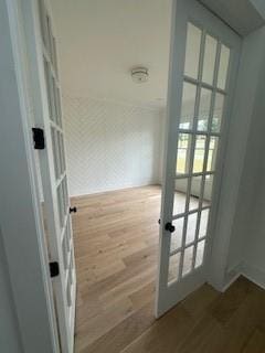 doorway to outside with french doors and wood finished floors