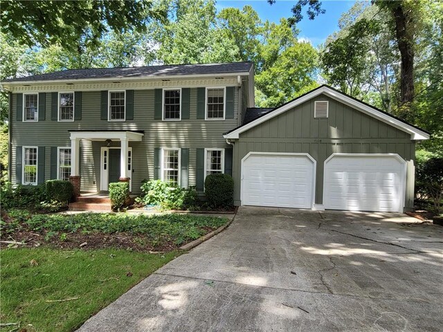 colonial-style house featuring a garage