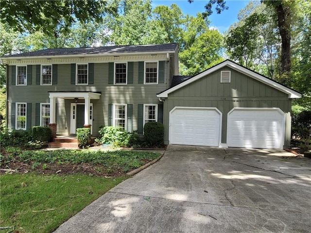 colonial home with a garage