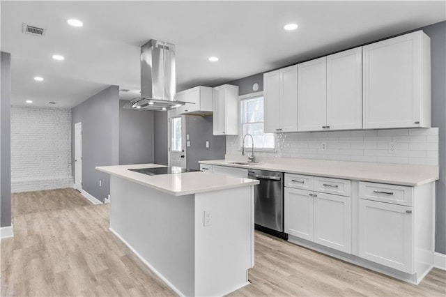 kitchen with black electric stovetop, a sink, stainless steel dishwasher, light wood-type flooring, and island exhaust hood