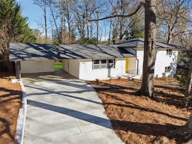 ranch-style home with a carport