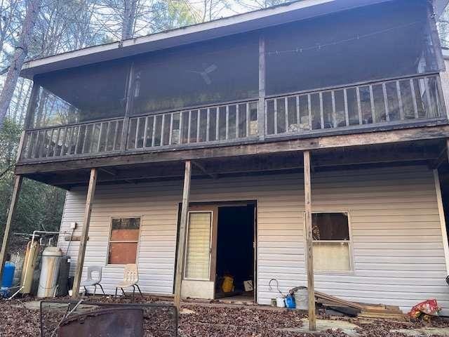 rear view of house featuring a balcony