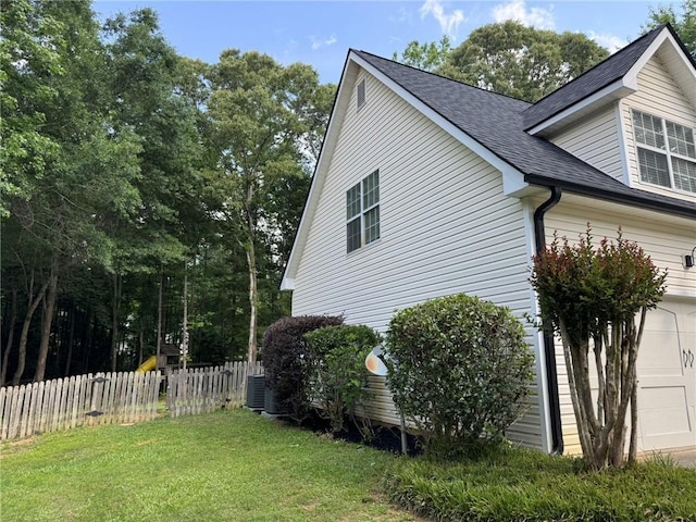 7454 Woody Springs Dr, Flowery Branch, GA 30542 - view of side of home featuring a shingled roof, cooling unit, and an attached garage