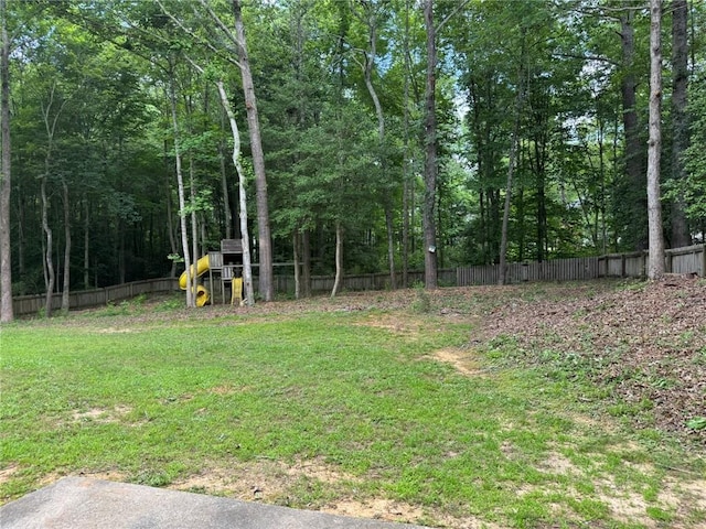 7454 Woody Springs Dr, Flowery Branch, GA 30542 - view of yard with a playground and a view of trees