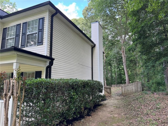 7454 Woody Springs Dr, Flowery Branch, GA 30542 - view of side of property with a chimney