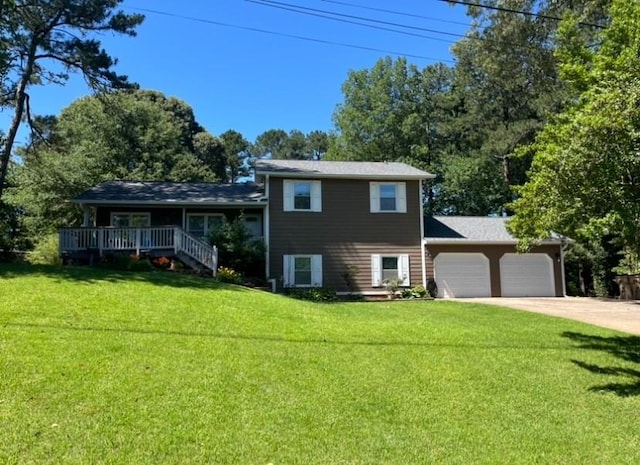 710 Wind Song Trce, Woodstock, GA 30189 - split level home featuring an attached garage, a front yard, driveway, and view of scattered trees