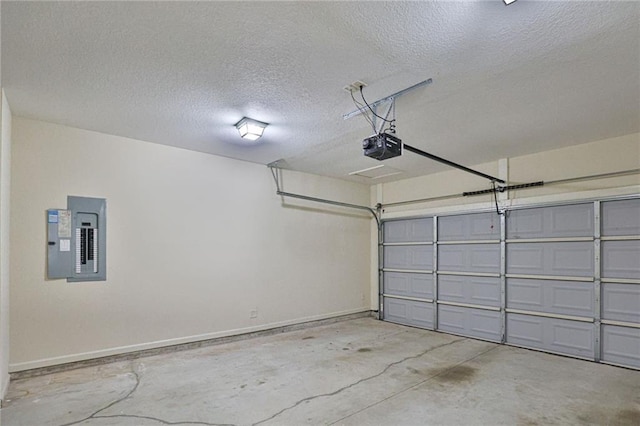 garage with electric panel, a garage door opener, and baseboards