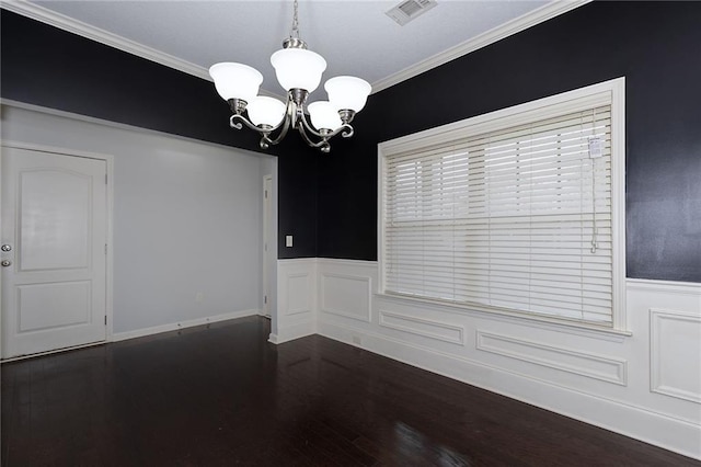 unfurnished dining area with visible vents, a notable chandelier, dark wood finished floors, and crown molding