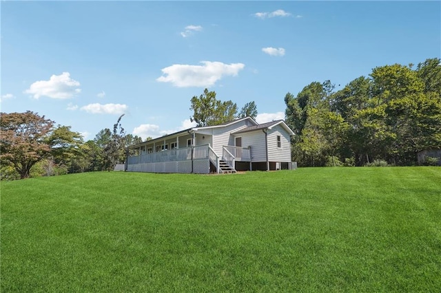 view of yard with a wooden deck