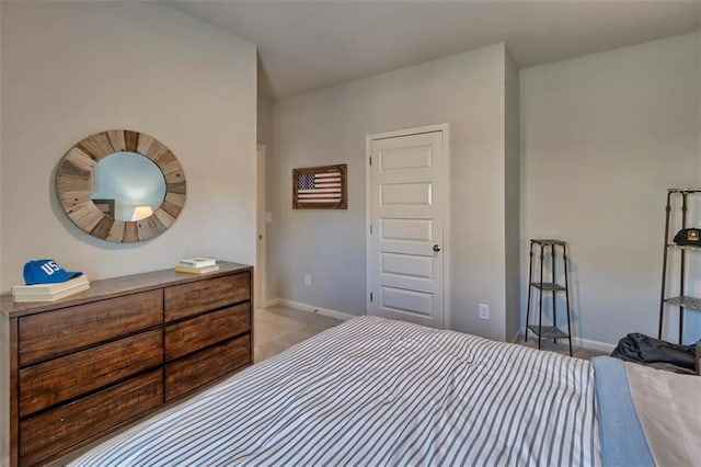 bedroom featuring carpet flooring and baseboards