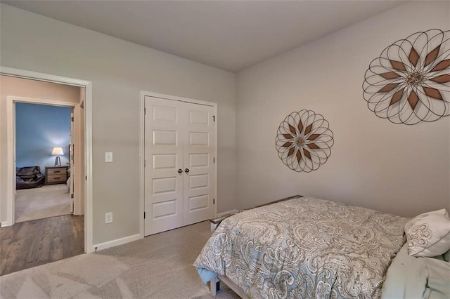 bedroom with carpet flooring and baseboards