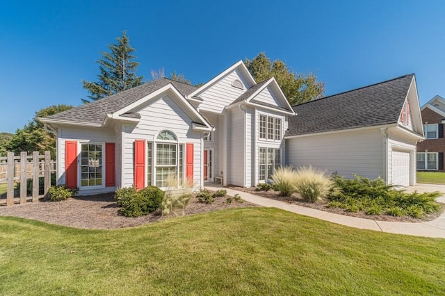 view of front of home featuring a garage and a front lawn