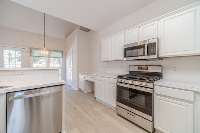 kitchen with white cabinetry, light hardwood / wood-style flooring, and appliances with stainless steel finishes