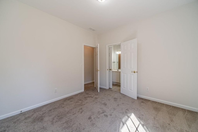 unfurnished bedroom with light colored carpet