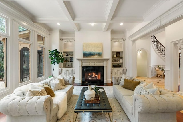 living room with light hardwood / wood-style flooring, beamed ceiling, and coffered ceiling