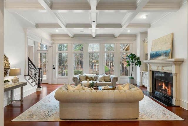 living room featuring a premium fireplace, dark hardwood / wood-style flooring, beamed ceiling, and coffered ceiling