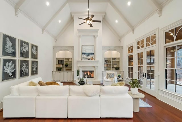 living room with high vaulted ceiling, french doors, ceiling fan, beamed ceiling, and dark hardwood / wood-style flooring