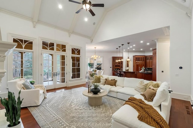 living room featuring french doors, dark hardwood / wood-style flooring, ceiling fan with notable chandelier, beam ceiling, and high vaulted ceiling