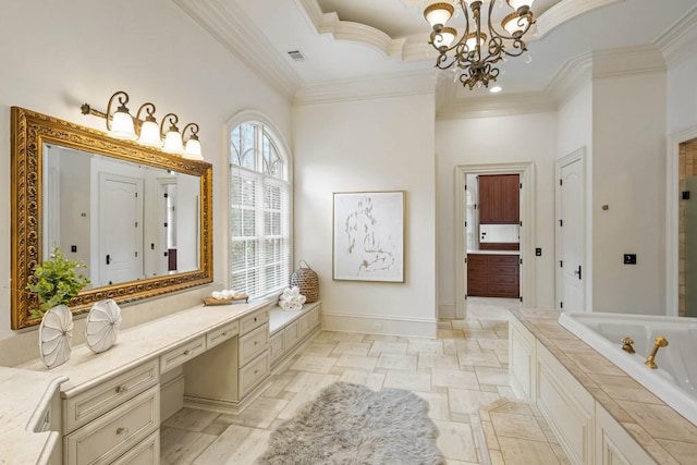 bathroom featuring a chandelier, a bath, vanity, and ornamental molding