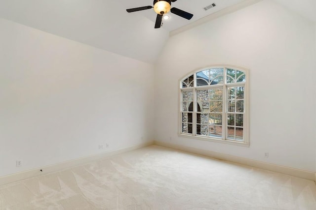 carpeted empty room featuring ceiling fan and high vaulted ceiling