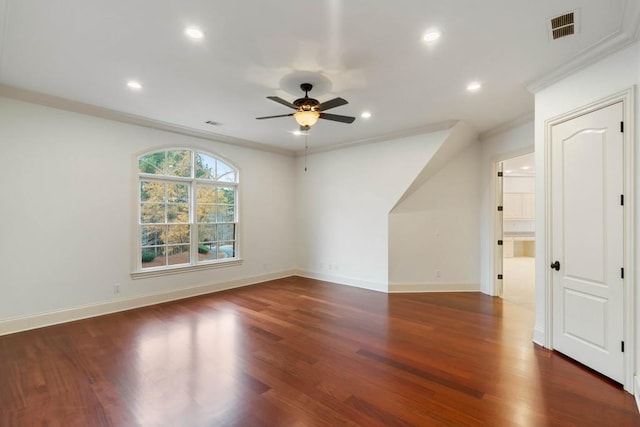 unfurnished room with dark hardwood / wood-style flooring, ceiling fan, and crown molding