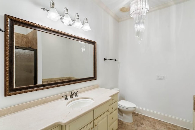 bathroom with an enclosed shower, ornamental molding, vanity, a notable chandelier, and toilet